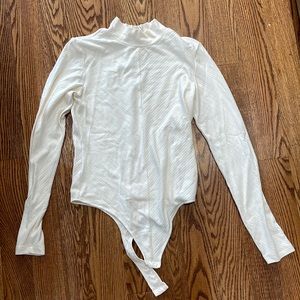 Beautiful cream turtleneck bodysuit- never worn!